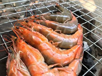 High angle view of fish on barbecue