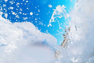 Close-up of water against blue sky