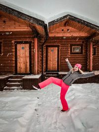 Woman with umbrella in snow during winter