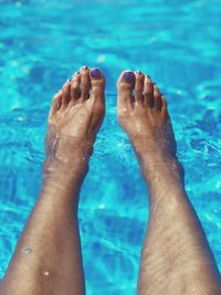 Low section of woman in swimming pool