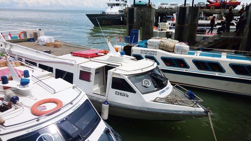 High angle view of boats moored at harbor