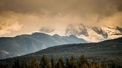 Scenic view of mountains against sky during winter