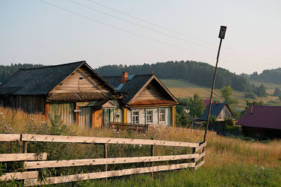 House on field against sky