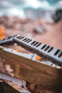 High angle view of rusty metal on wood