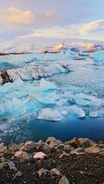 Aerial view of frozen sea against sky