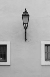 Low angle view of street light against building