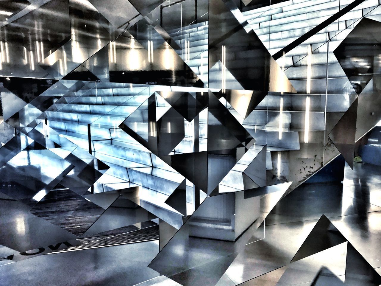 FULL FRAME SHOT OF GLASS WALL WITH ABSTRACT PATTERN
