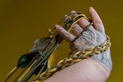 Close-up of man holding rope