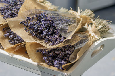 Bunches of dry lavender wrapped in paper packaging.