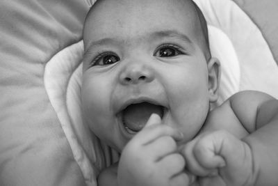 Close-up portrait of cute baby smiling