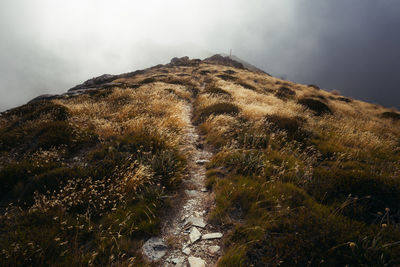 Scenic view of land against sky