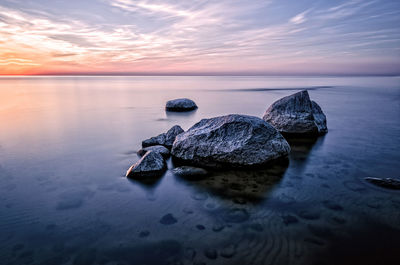 Scenic view of sea against sky at sunset