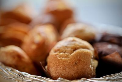 Close-up of fresh bread in basket on table