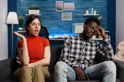 Young couple sitting on sofa