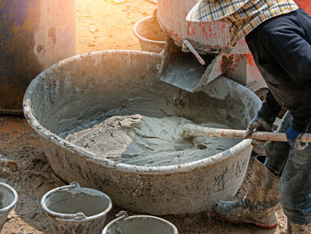 Low section of man working in market