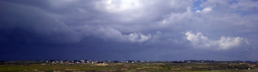Panoramic view of storm clouds over land