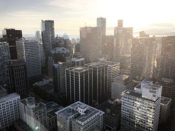 High angle view of buildings in city against sky