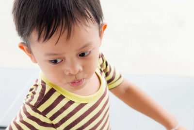 High angle view of thoughtful boy looking away