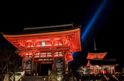 Low angle view of illuminated temple against sky at night