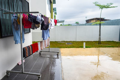 Clothes drying against buildings in city