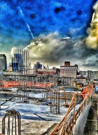 Buildings against cloudy sky
