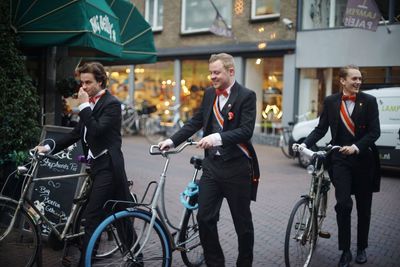 People riding bicycle on city street