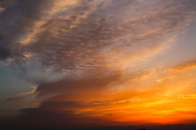 Low angle view of dramatic sky during sunset