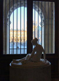 Man sitting by window