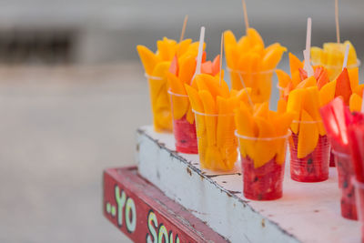 Close-up of orange juice in row
