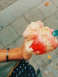 Midsection of woman holding ice cream cone