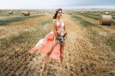 Woman standing on field