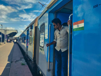 A passenger is traveling in an indian train. howrah to digha train. indian railways. journey.