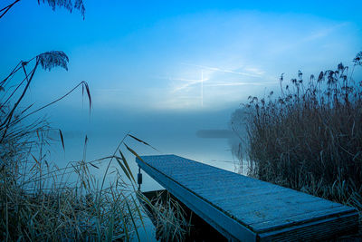 Scenic view of lake against blue sky