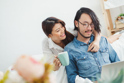 Young couple looking at camera