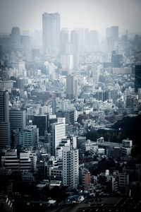 High angle view of buildings in city against sky