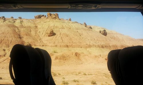 Man on desert against sky