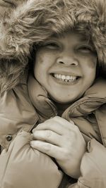 Portrait of cheerful woman wearing fake fur