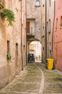 Narrow alley along buildings