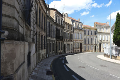 Street in city against sky