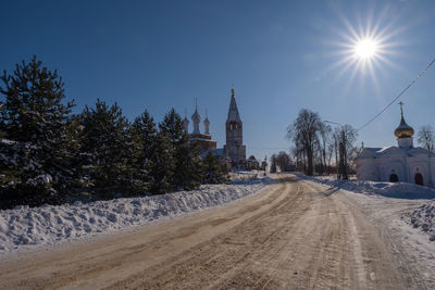 Panoramic shot of building against sky during winter