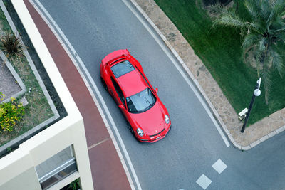 High angle view of red car on street