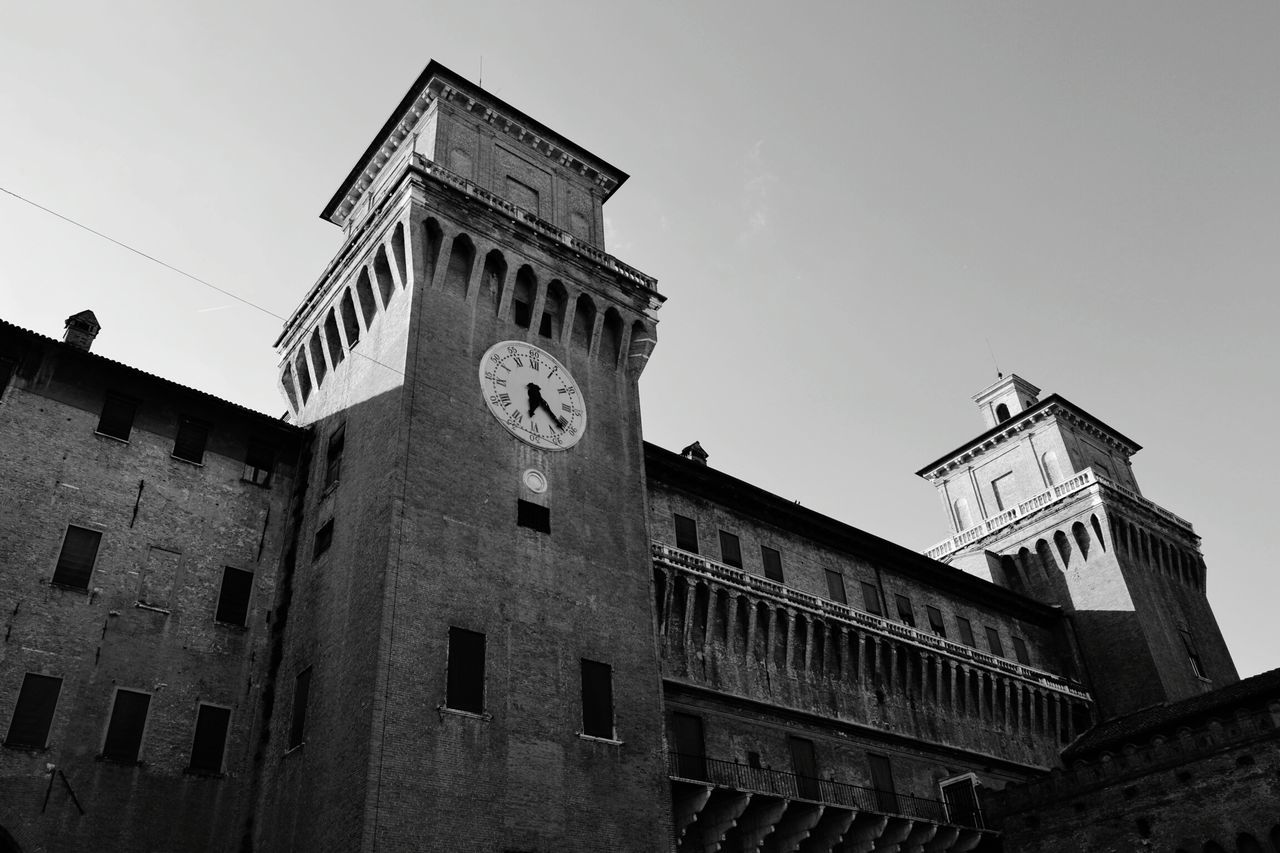 architecture, low angle view, building exterior, built structure, history, clock, time, clock tower, no people, outdoors, day, sky, travel destinations, roman numeral, clock face