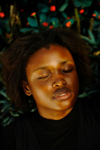 Close-up of young woman sleeping indoors