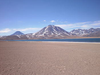 High angle view of snowcapped mountain against cloudy sky