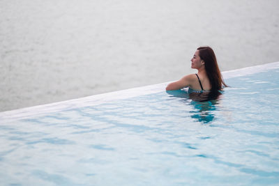 Woman swimming in pool