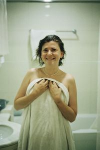 Portrait of young woman sitting at home