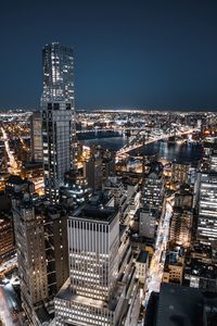 High angle view of illuminated buildings in city at night