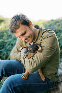 Side view of man with dog