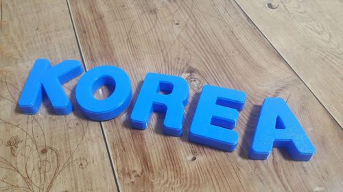 High angle view of blue toy on wooden table