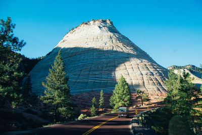 Scenic view of mountains against clear blue sky